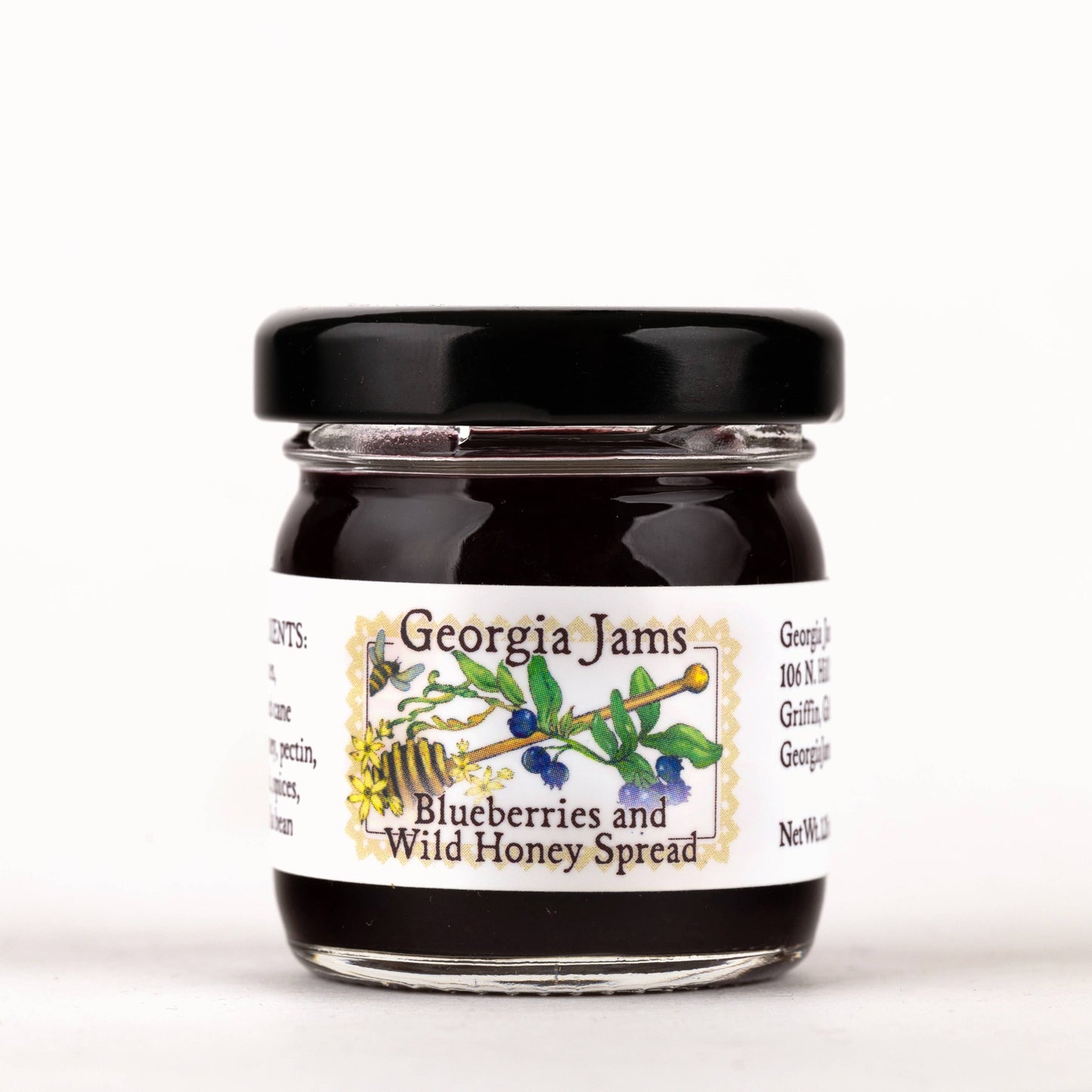 A jar of Georgia Jams Blueberries and Wild Honey Spread on a white background.