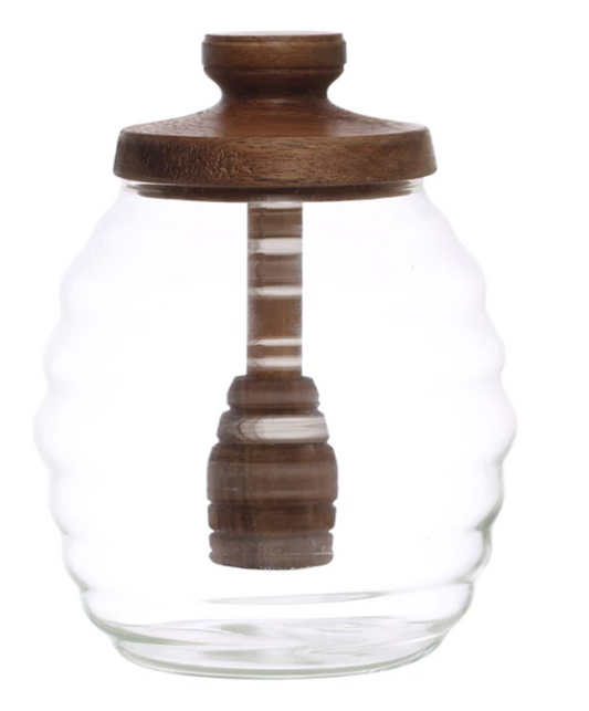 Round glass honey jar with wood dipper