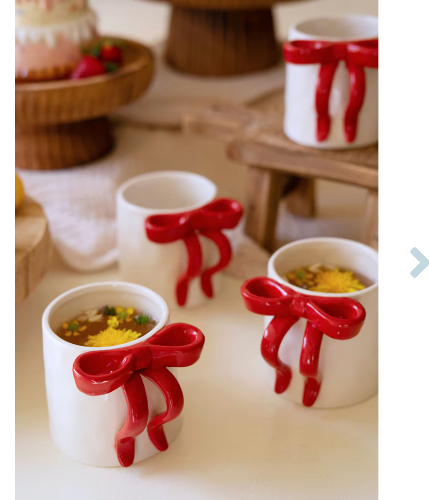 Holiday mug with red bow handle