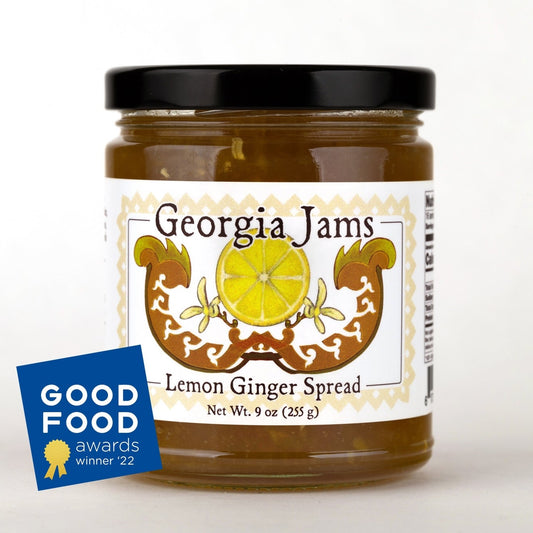 A jar of Lemon Ginger Spread with the Georgia Jams label, displaying an illustration of a lemon and ginger. There is also a Good Food Awards Winner badge for 2022 displayed in the image.